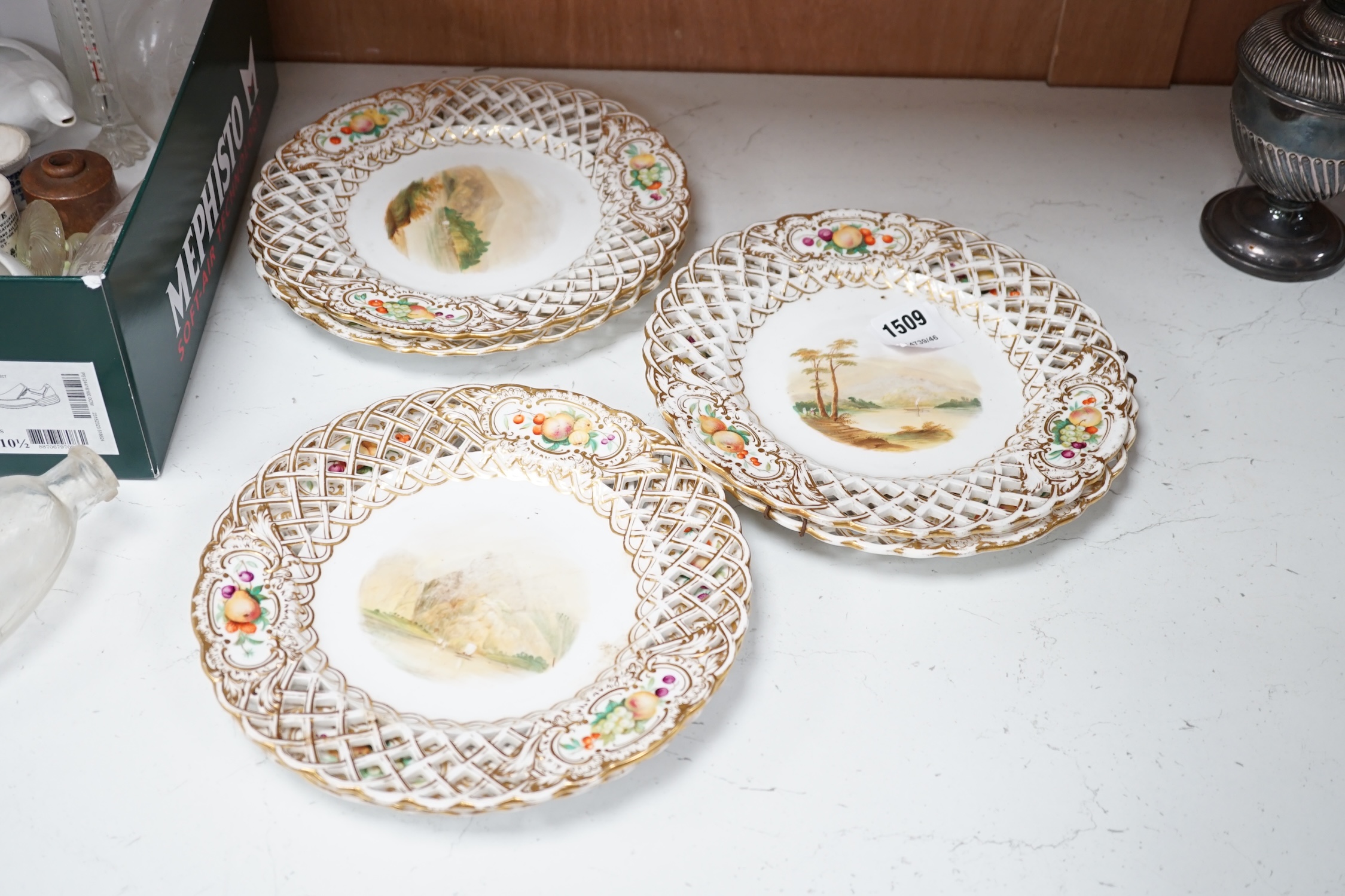 A set of six Victorian gilt and floral cabinet plates with central landscapes, 24cm diameter. Condition - poor